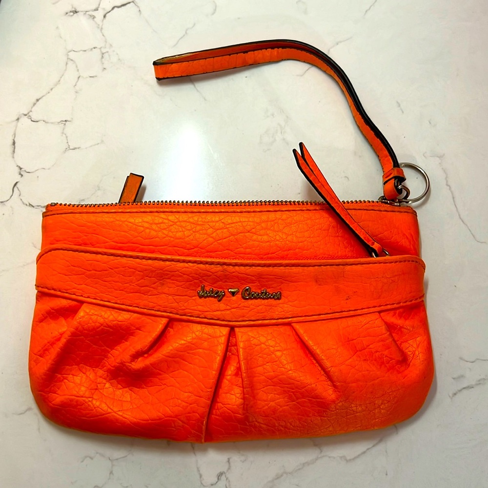 Used bright summer orange Juicy Couture wristlet!